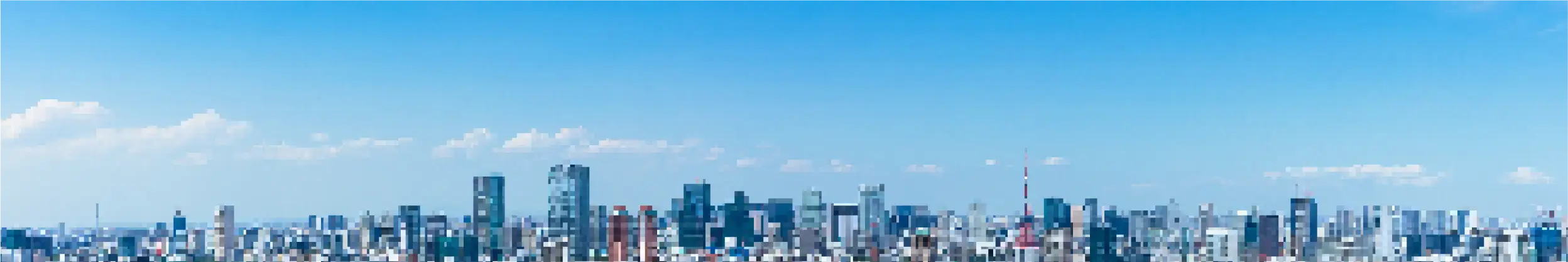 ビル群を青空が移るくらい引きで見た写真